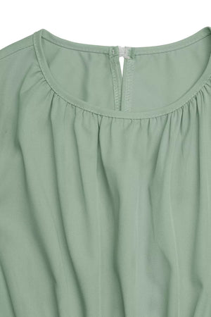 Green a-line dress with ruched neckline and keyhole back detail