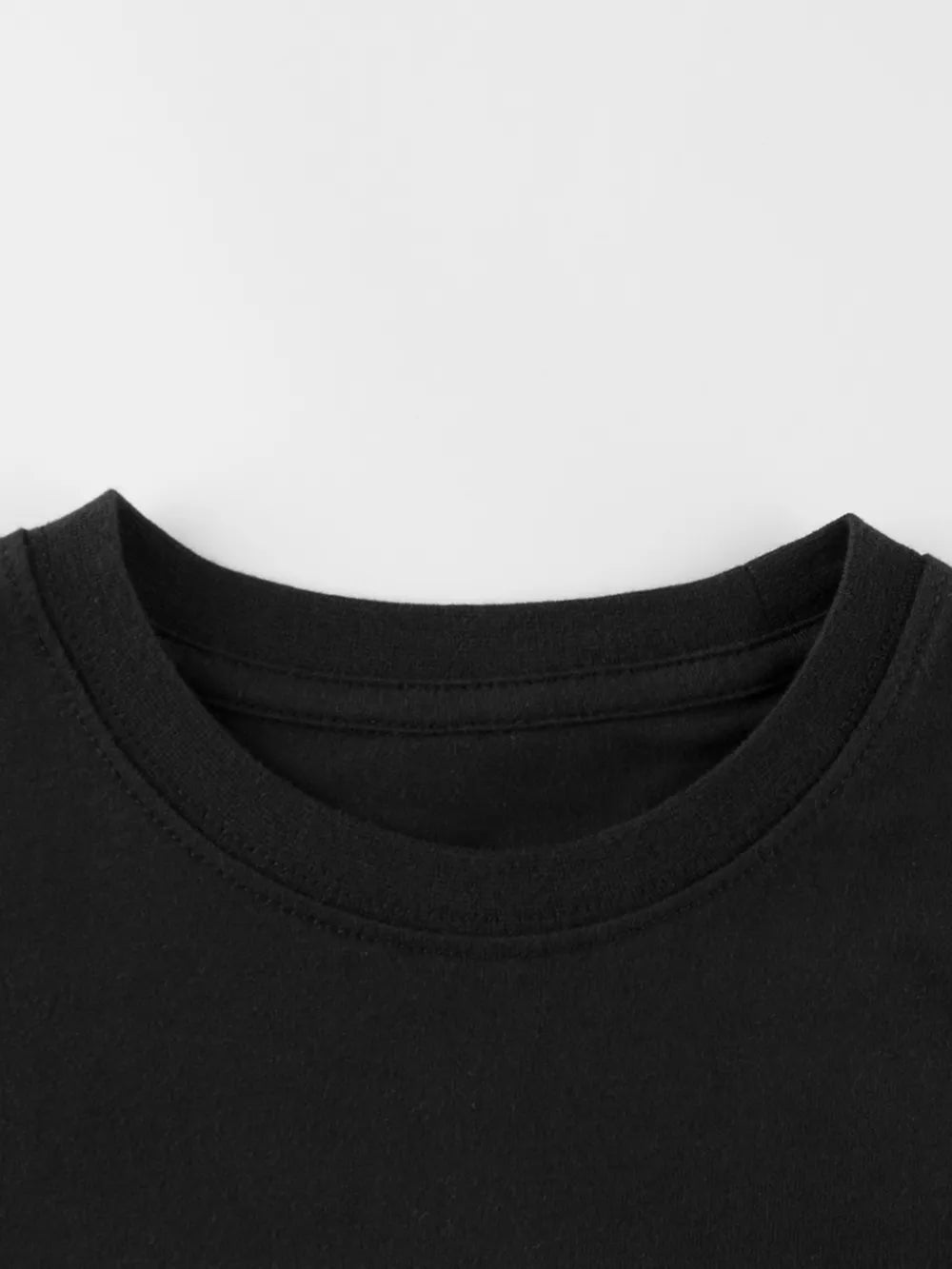 Black crewneck t-shirt with short sleeves and a classic fit.