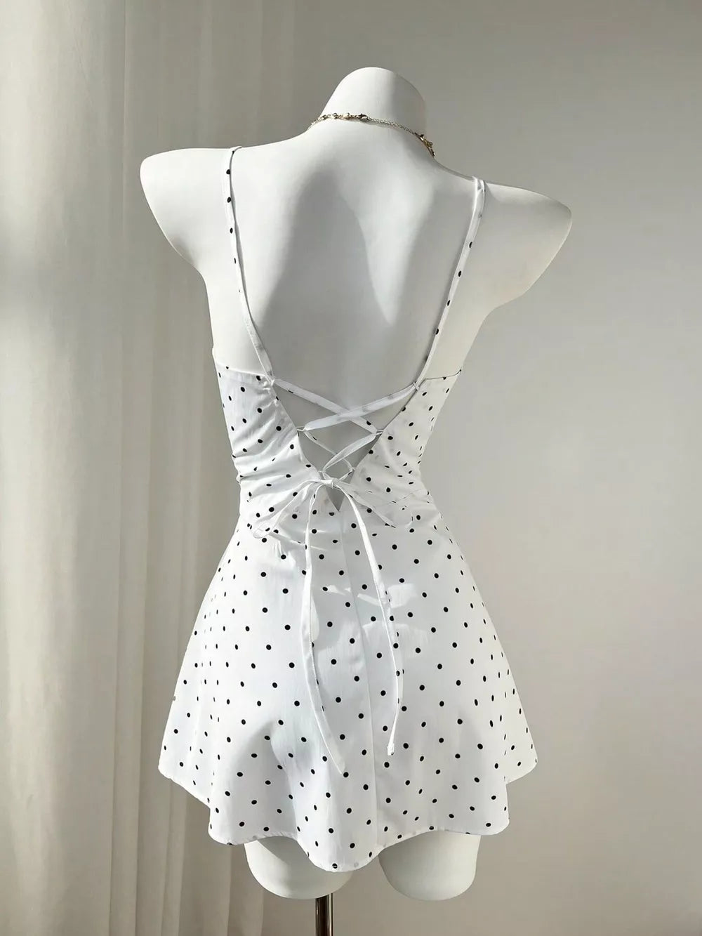 White mini dress with button-front and polka dot