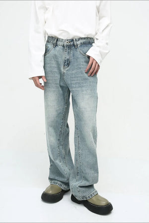 Baggy denim jeans in medium wash with subtle fade and relaxed fit.