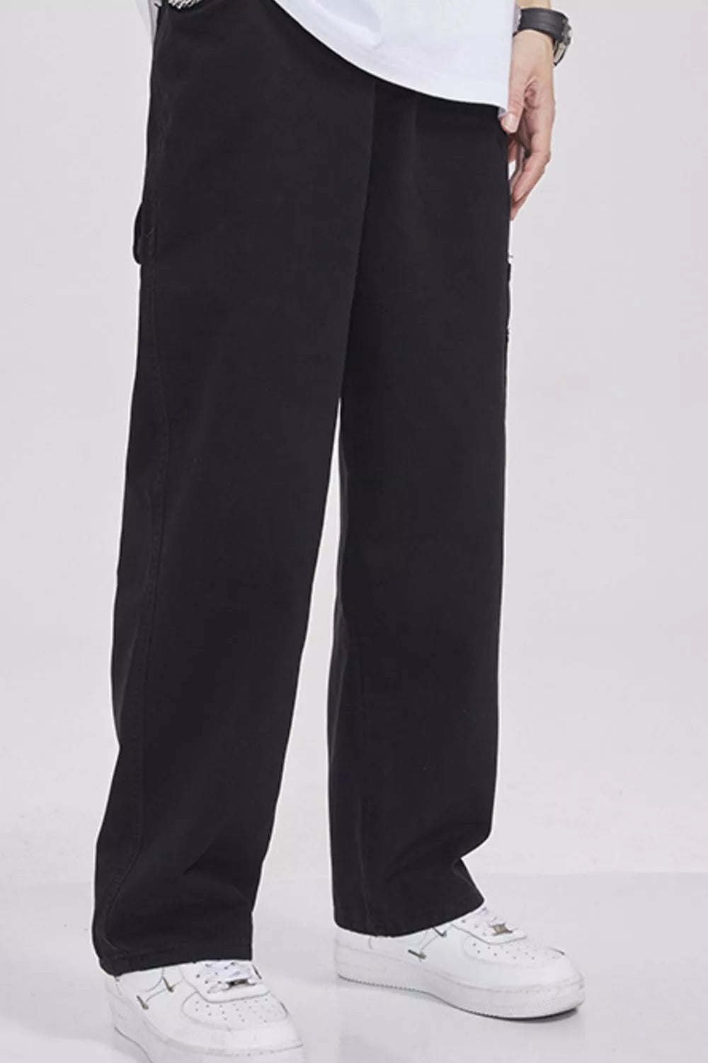 Relaxed fit black cargo sweatpants with utility pockets and a casual style.