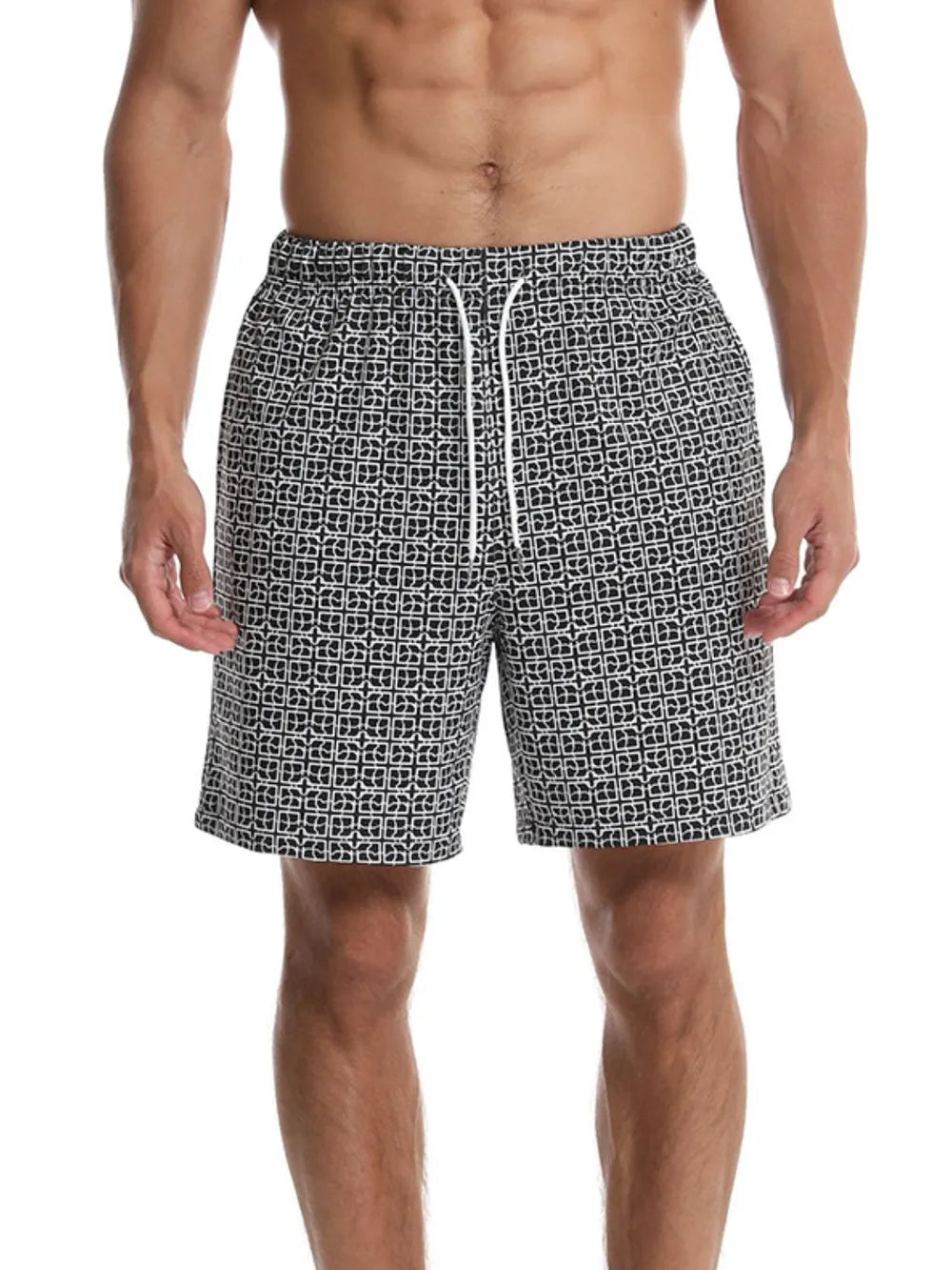 Black geometric print boardshorts with white drawstring and elastic waist.