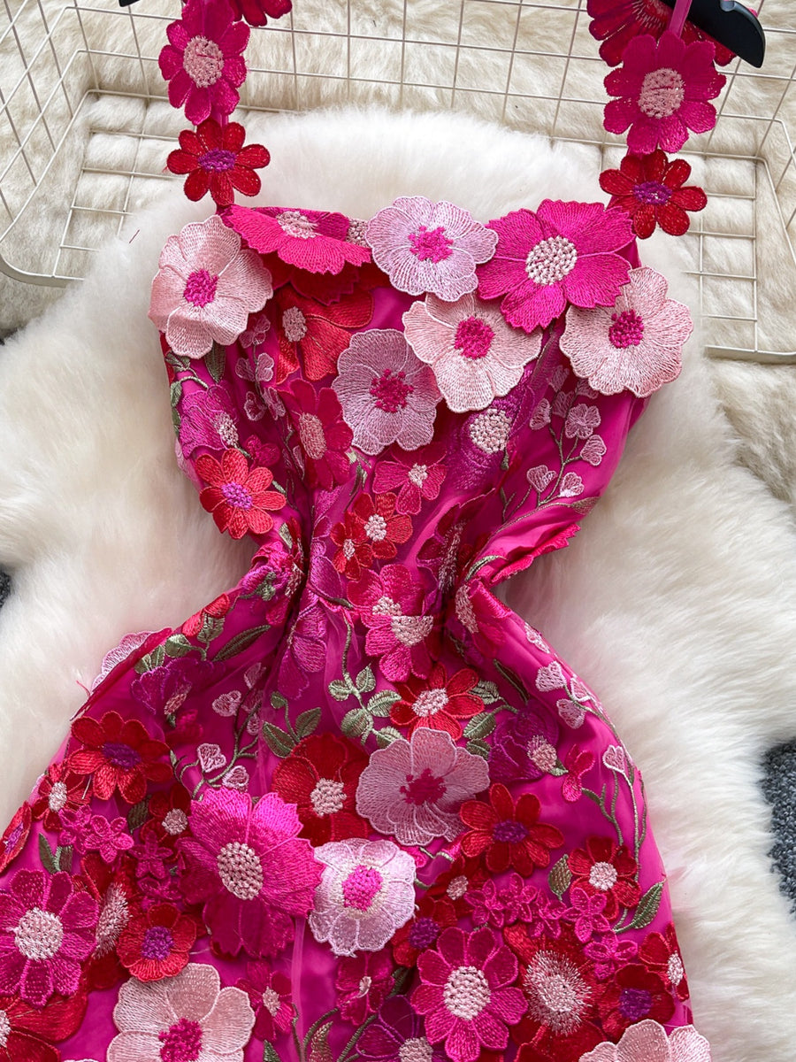 Embroidered floral mini dress in vibrant pink with 3D flower appliques and delicate straps.