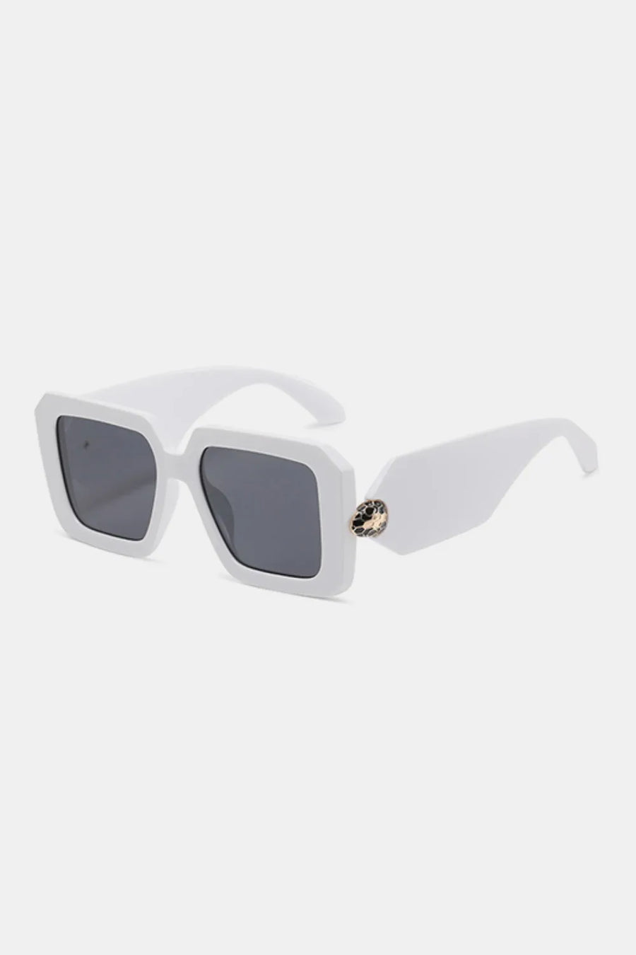 White geometric facet sunglasses with dark lenses and a jeweled embellishment on the arm.
