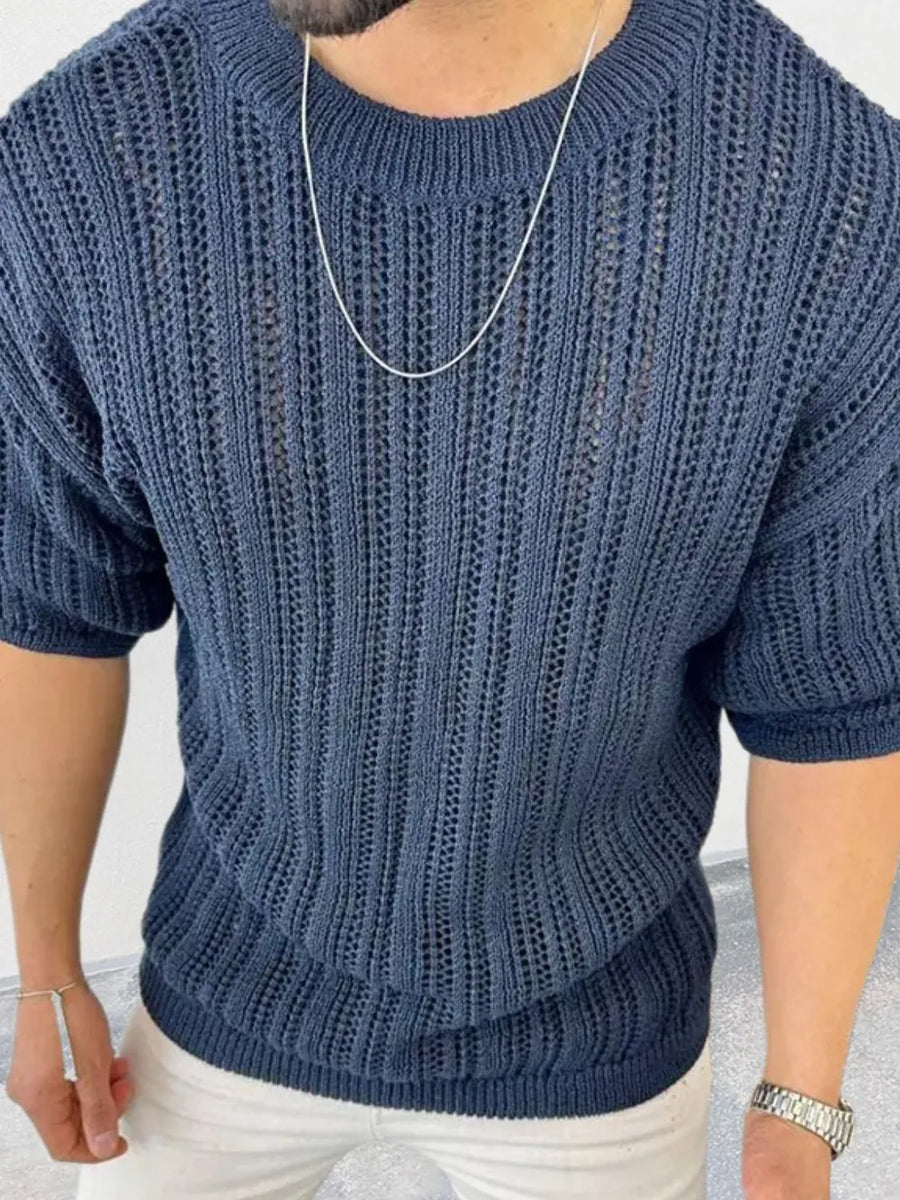 Navy open-knit crew neck sweater with boxy fit and short sleeves.