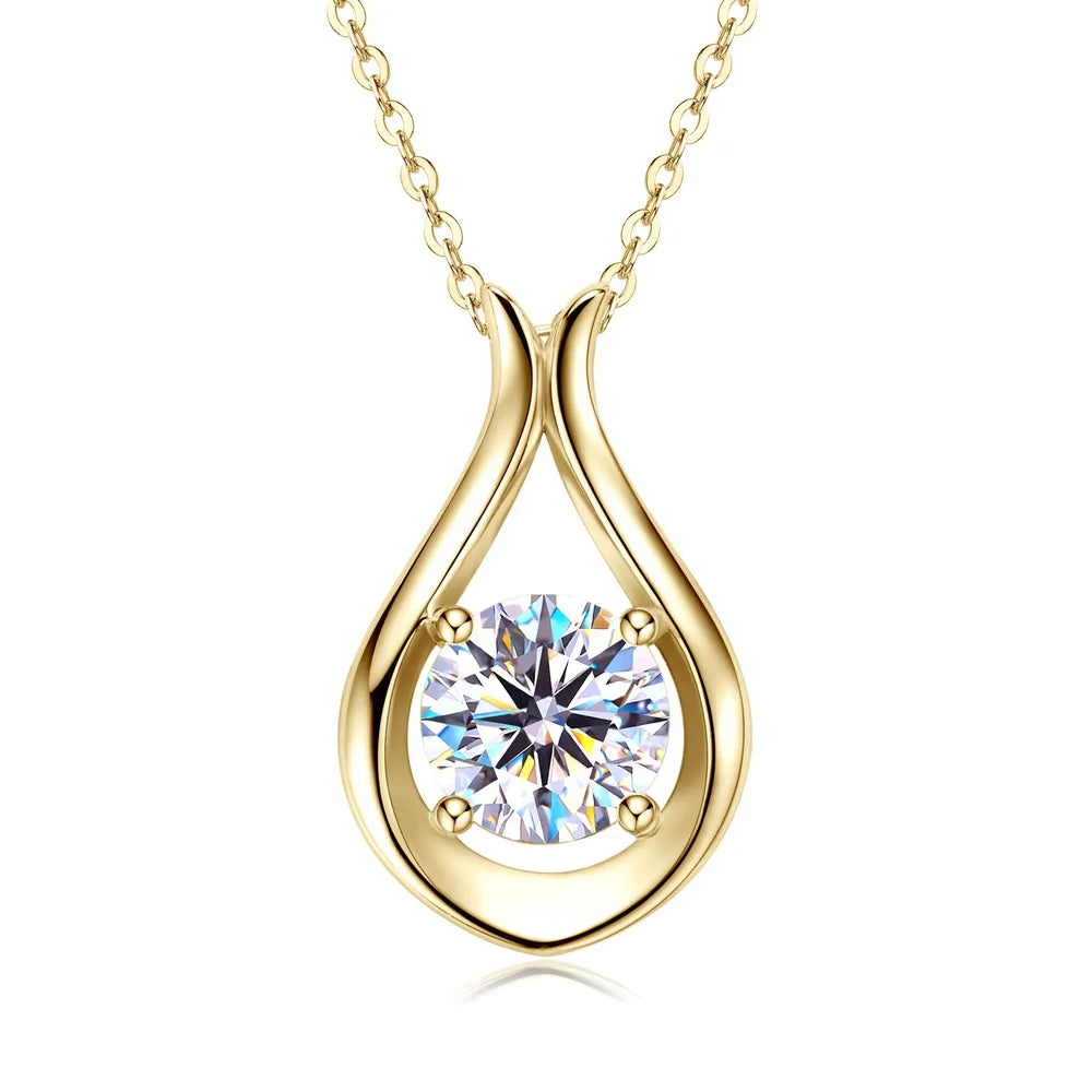 Gold teardrop pendant necklace with a sparkling moissanite stone.