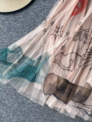 Tulle skirt in off-white with abstract sunburst, bee, and cloud print.