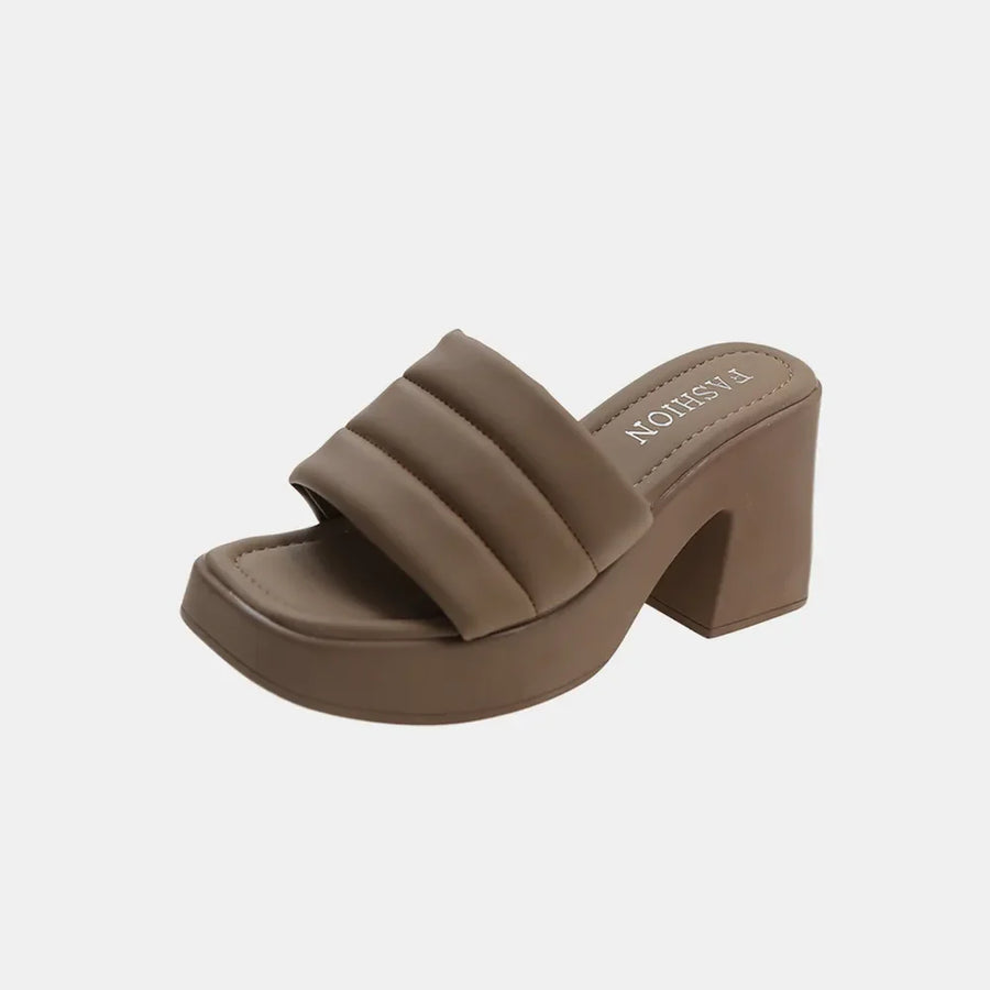 Padded platform mules in mocha with a square toe and block heel.