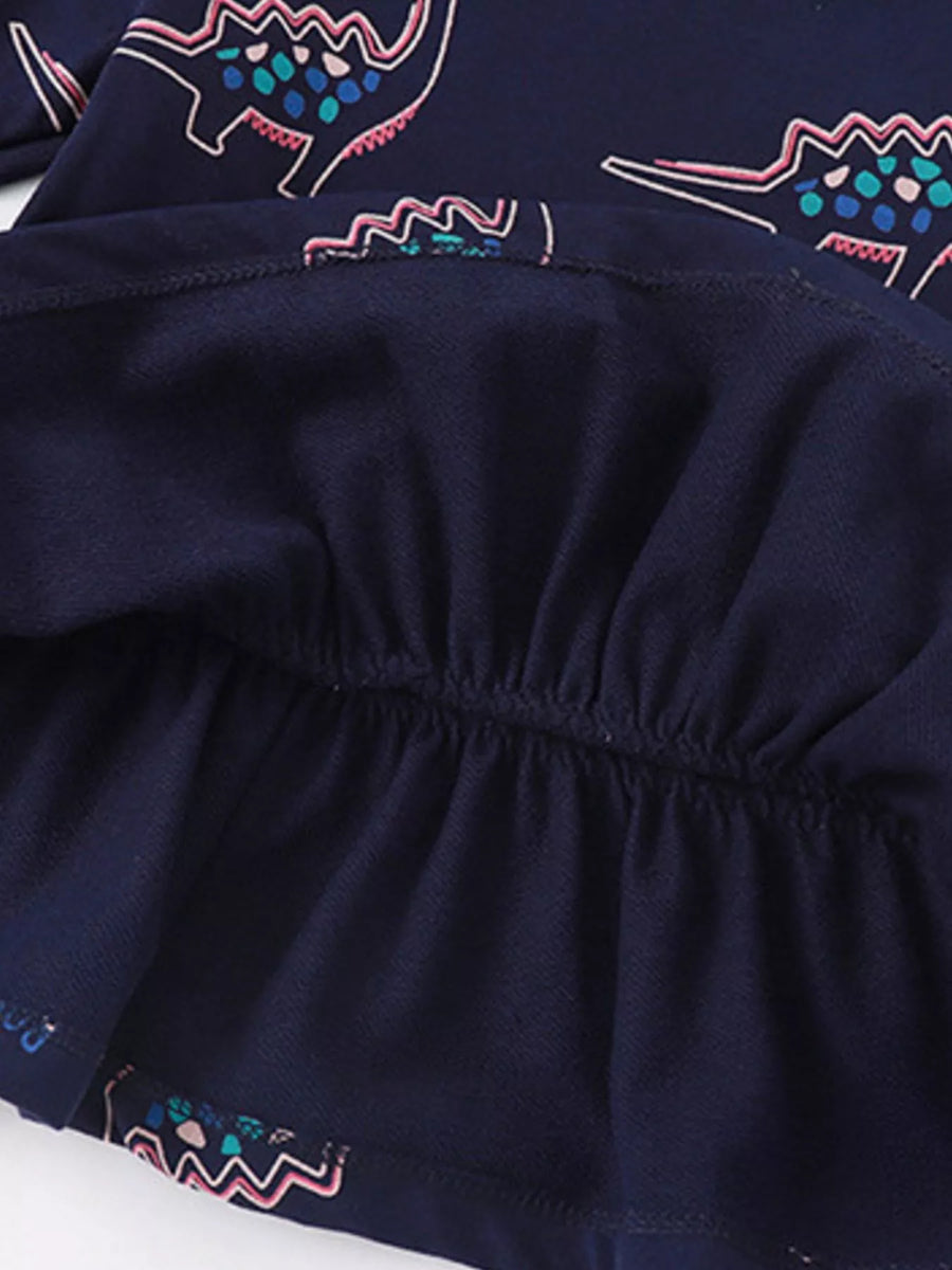 Dark navy cotton sweatshirt with dinosaur print and ruffled hem detail.