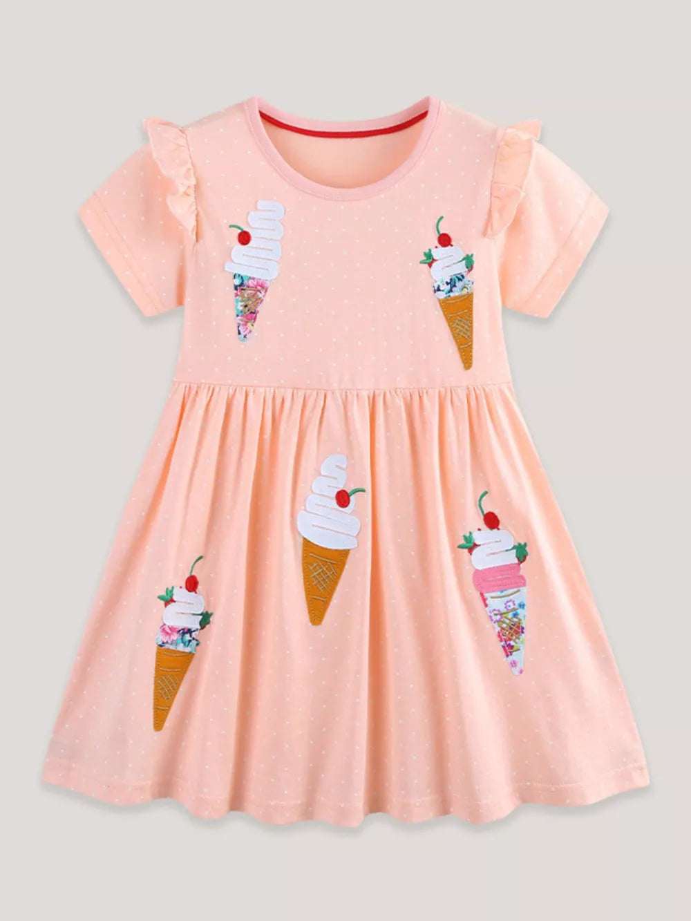 Peach cotton toddler dress with ice cream appliques and ruffled sleeves.