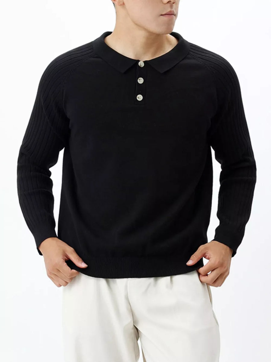 Black cotton knit polo shirt with ribbed sleeves and a three-button placket.