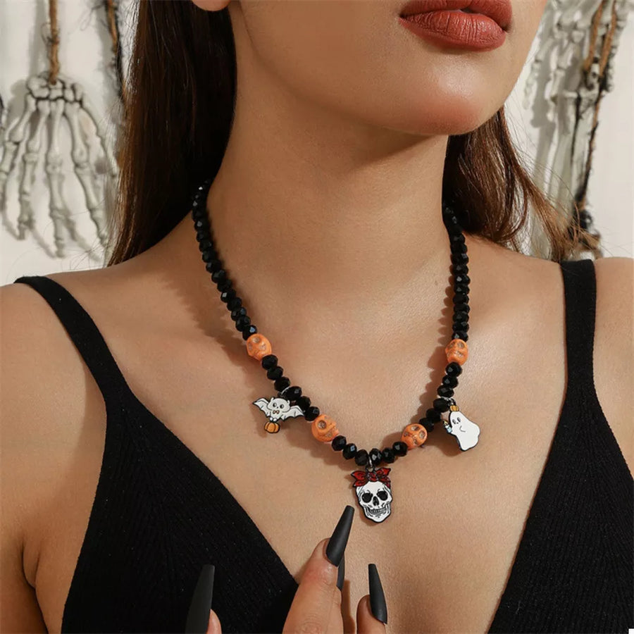 white necklace featuring charm details and novelty