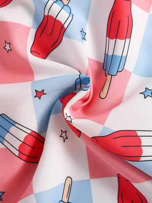 Toddler outfit fabric with popsicle and star print on pink, blue, and white checkered background.