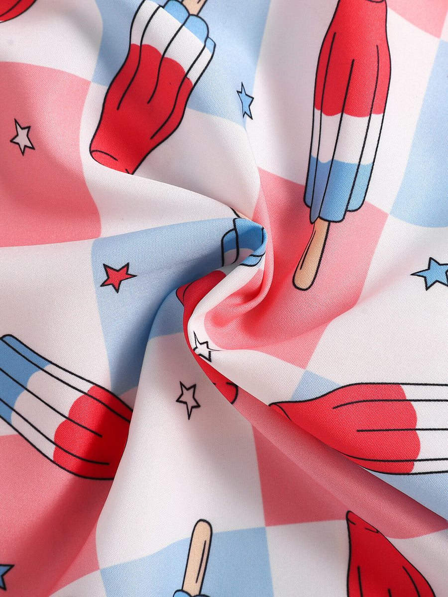Toddler outfit fabric with popsicle and star print on pink, blue, and white checkered background.