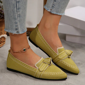 Chartreuse knit pointed flats with chain-stitched bow detail and trim.
