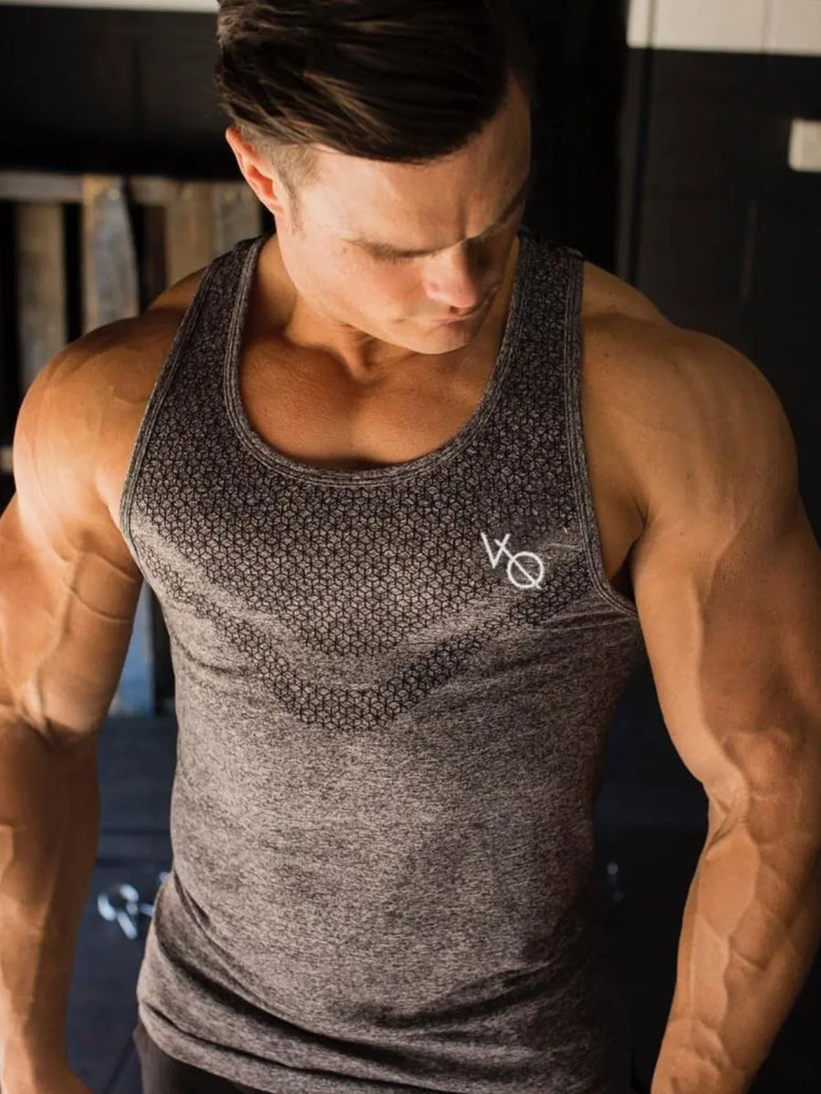 Gray performance knit active tank top with subtle geometric pattern and logo
