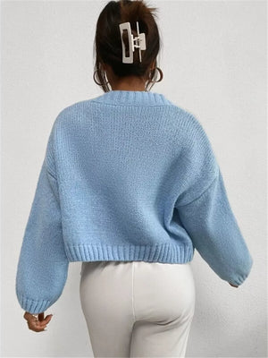 Light blue acrylic button cardigan with cloud pattern and balloon sleeves.