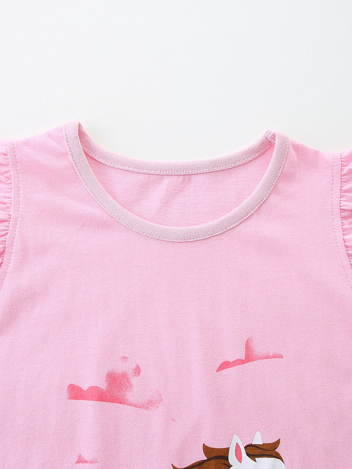 Girls' pink cotton tank top with galloping horse graphic and ruffled sleeves.