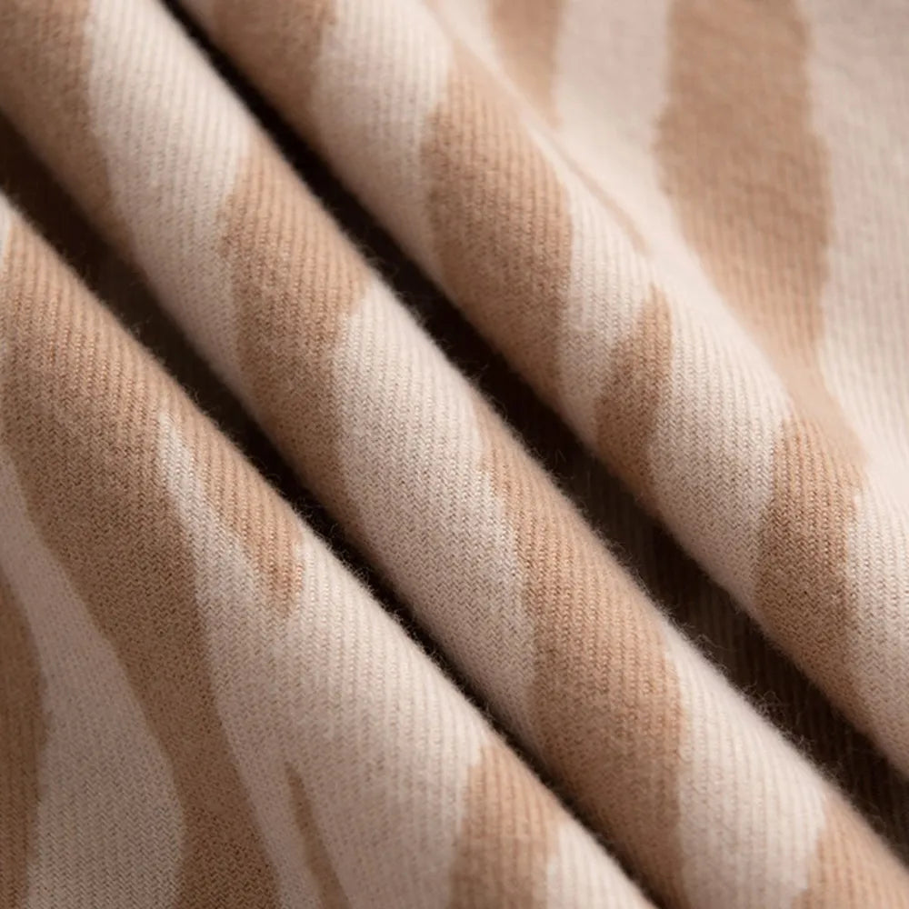 Zebra stripe wool scarf in khaki with soft fringe detail.