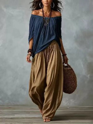 Black And White off-shoulder top with elasticized neckline and dolman sleeve