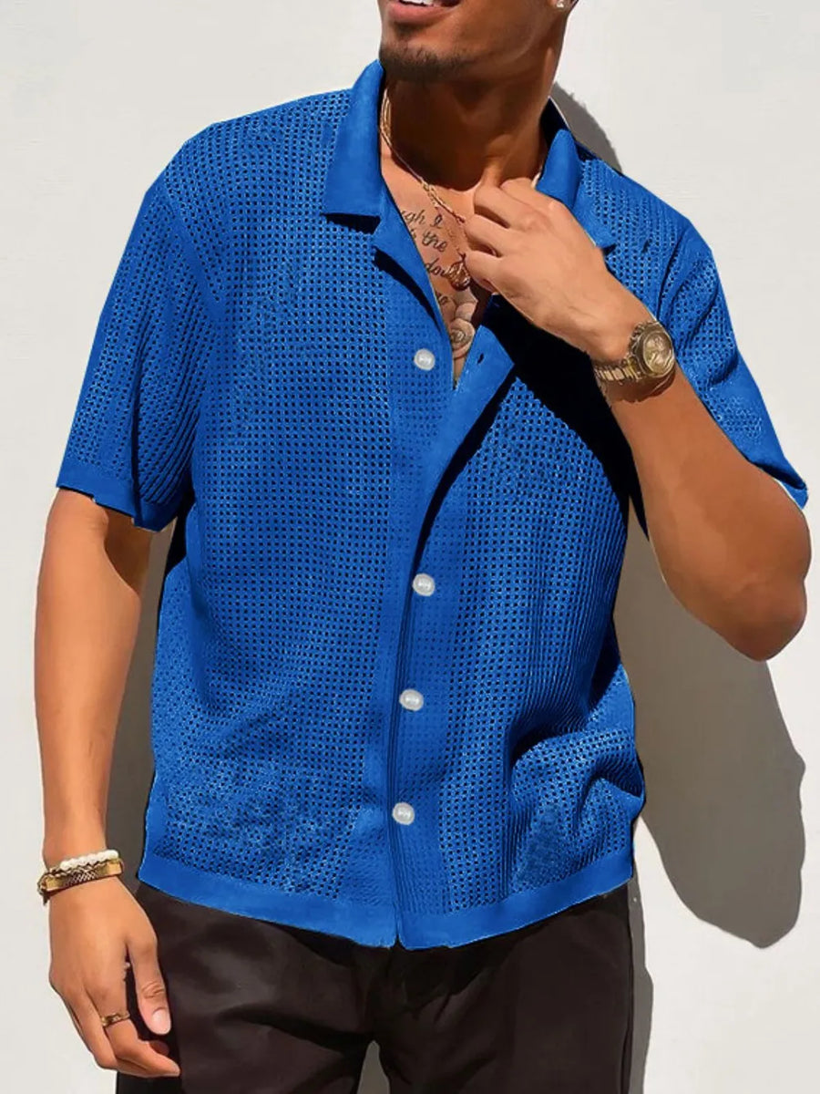 Royal blue perforated knit resort shirt with short sleeves and a button-up front.