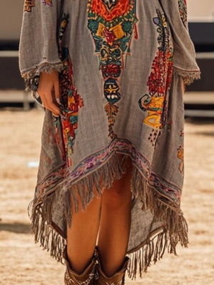 Bohemian gray long-sleeve dress with colorful print and fringe hem.