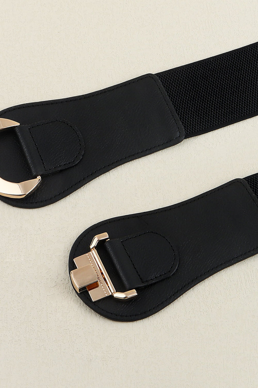 Black elasticated corset belt with sculpted gold alloy buckle detail