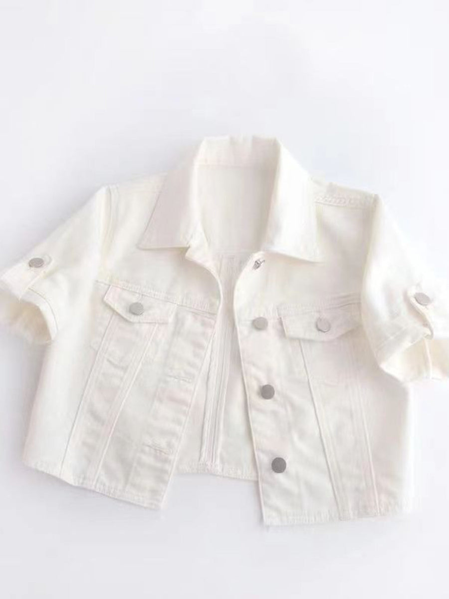 White denim cropped jacket with rolled sleeves and silver buttons