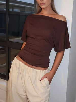 Brown draped tie-front short sleeve t-shirt with off-the-shoulder neckline.