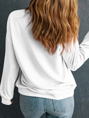 White crewneck sweatshirt with graphic detail on back, long sleeves, casual fit.