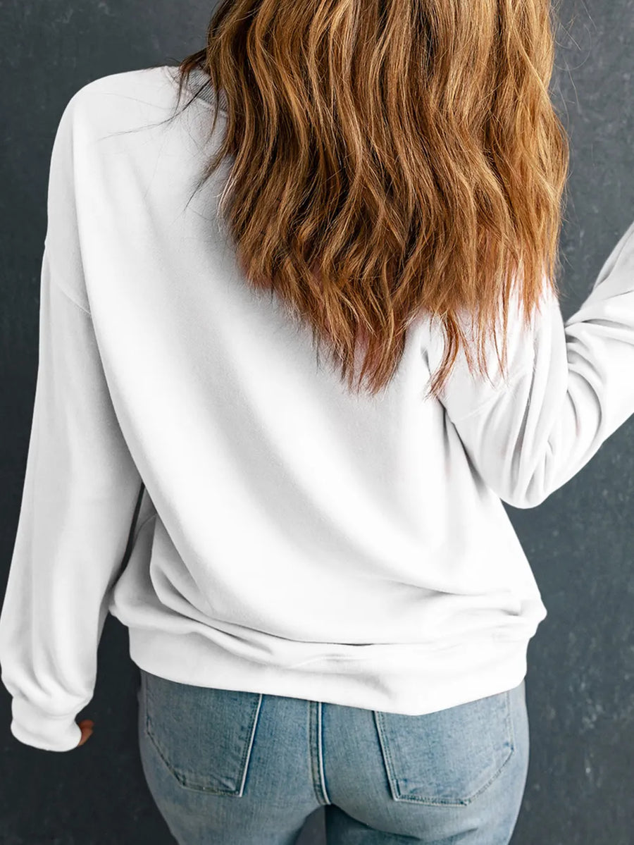 White crewneck sweatshirt with graphic detail on back, long sleeves, casual fit.
