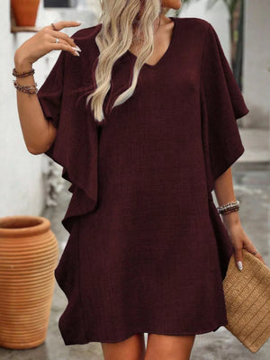 Wine red V-neck mini dress with flowy sleeves and ruffled hem.