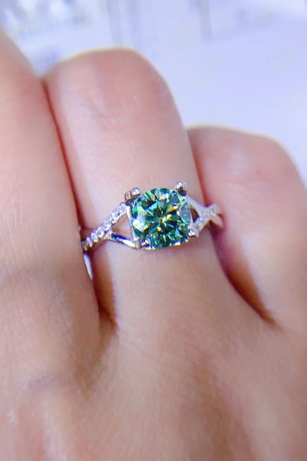Veridian Halo Sterling Ring with light green center stone and diamond accents