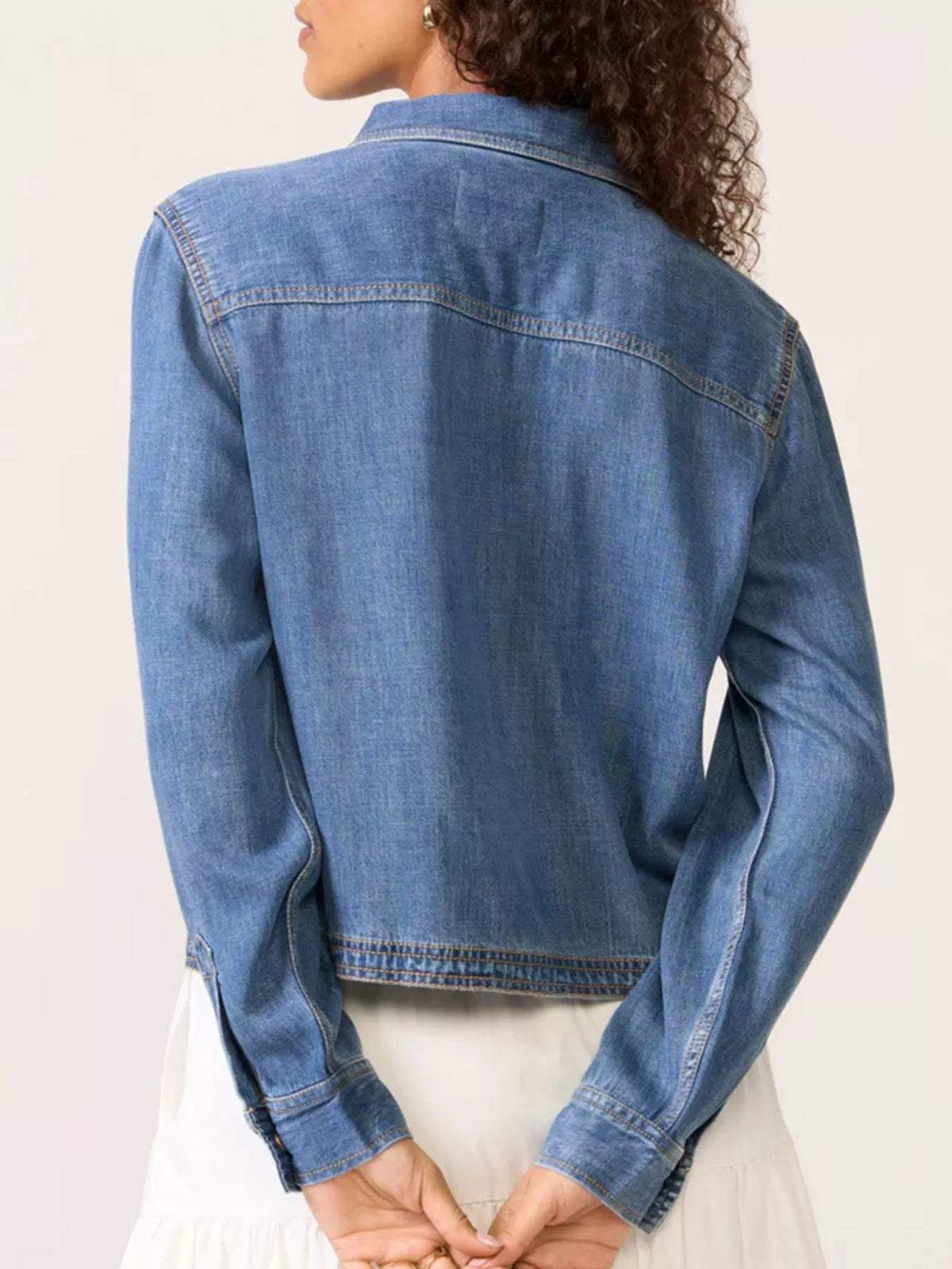 Blue denim cropped half snap top with collar and long sleeves