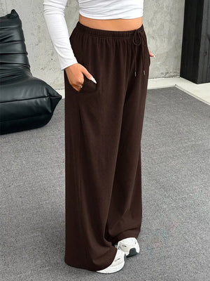 Brown drawstring wide-leg maternity pants with pockets.