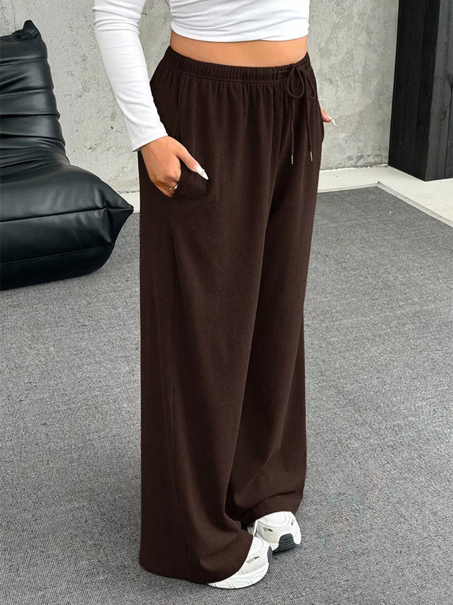 Brown drawstring wide-leg maternity pants with pockets.