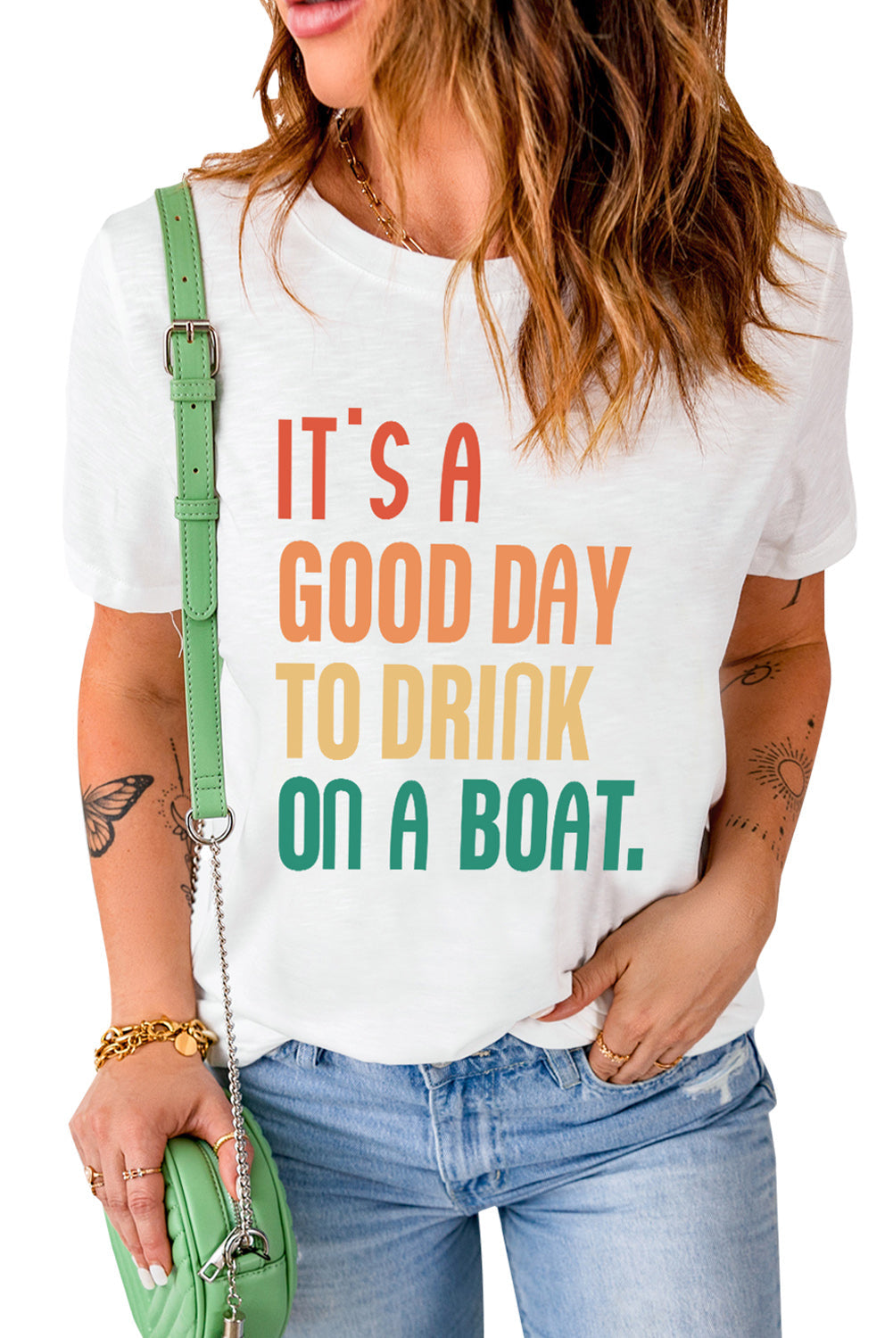 White graphic t-shirt with colorful text that says It's a good day to drink on a boat.