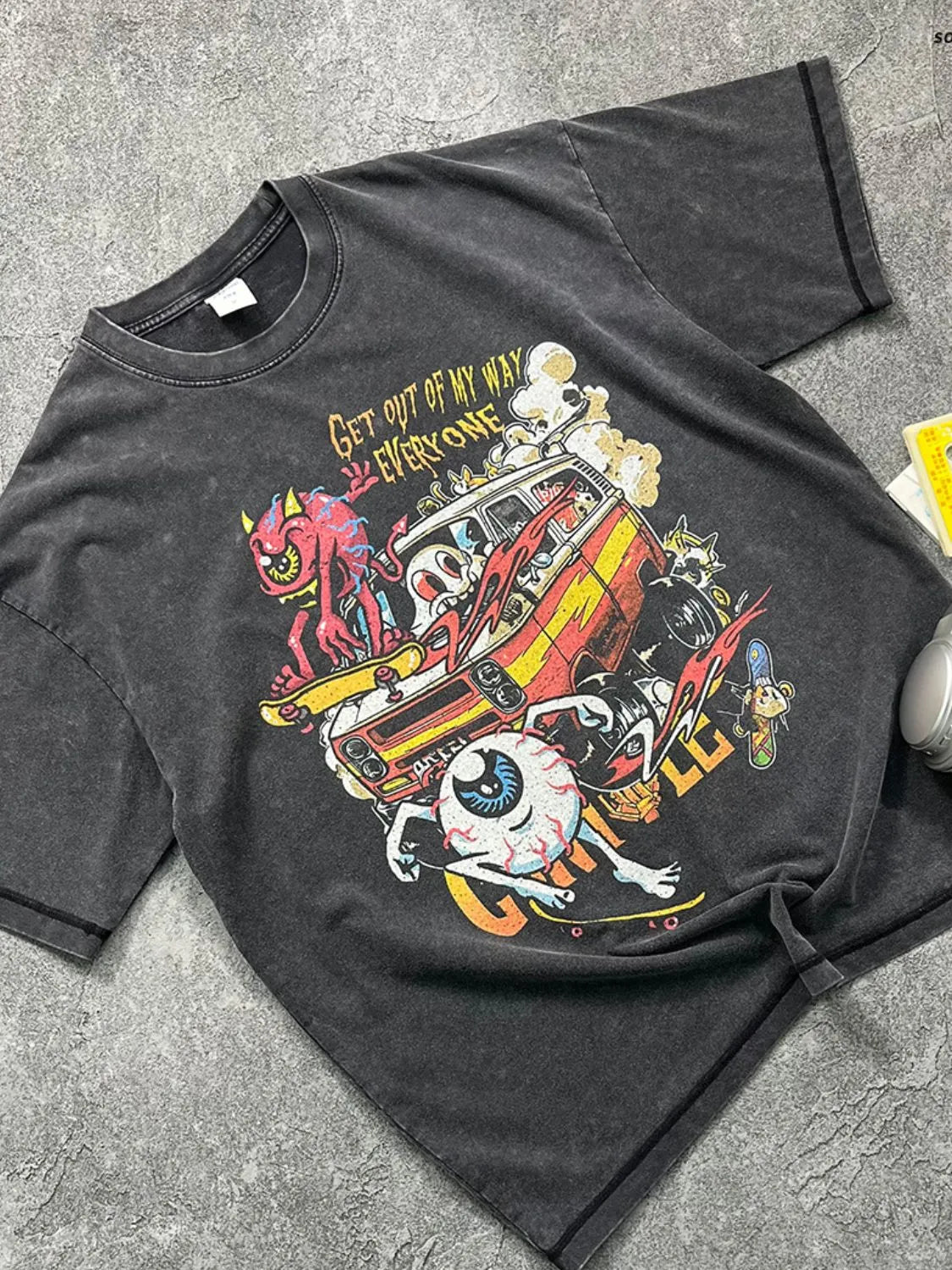 Acid wash black cotton graphic tee with cartoon print and text GET OUT OF MY WAY EVERYONE