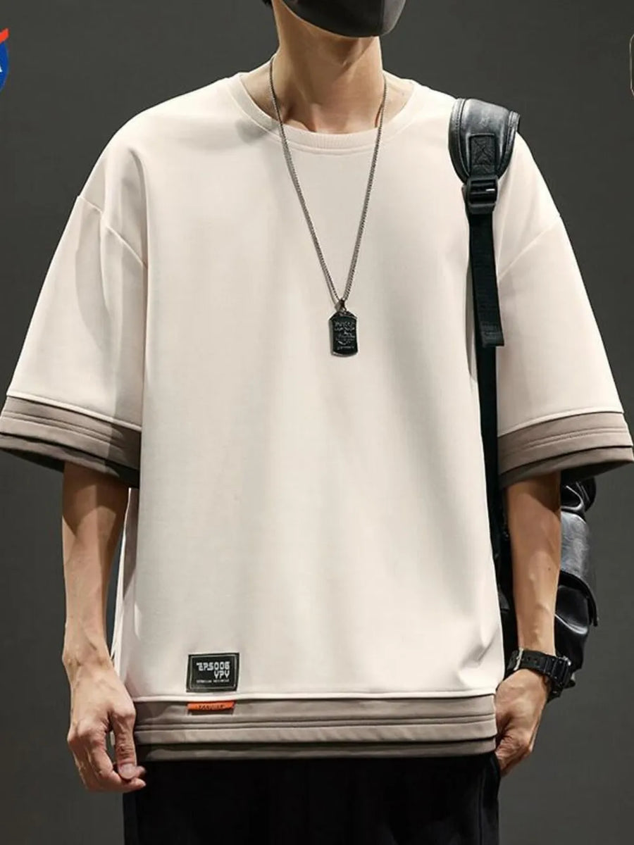 Men's beige cotton blend t-shirt with contrast stitching on sleeves and hem.