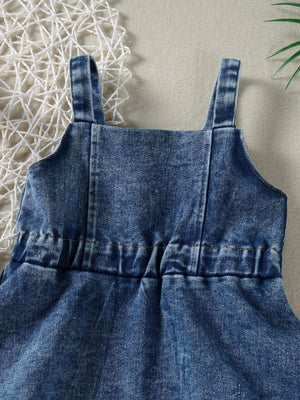 Blue denim overall dress for kids with adjustable straps and elastic waist detail.