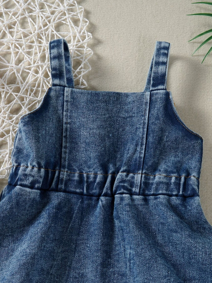 Blue denim overall dress for kids with adjustable straps and elastic waist detail.
