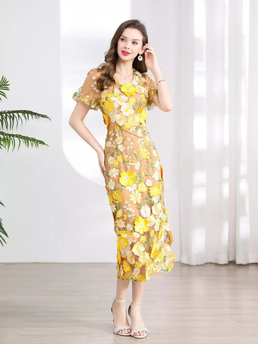 Sheath dress in sheer yellow floral embroidery, short puff sleeves, V-neck, midi length.