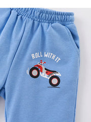 Blue toddler shorts with ATV print and "Roll With It" text.