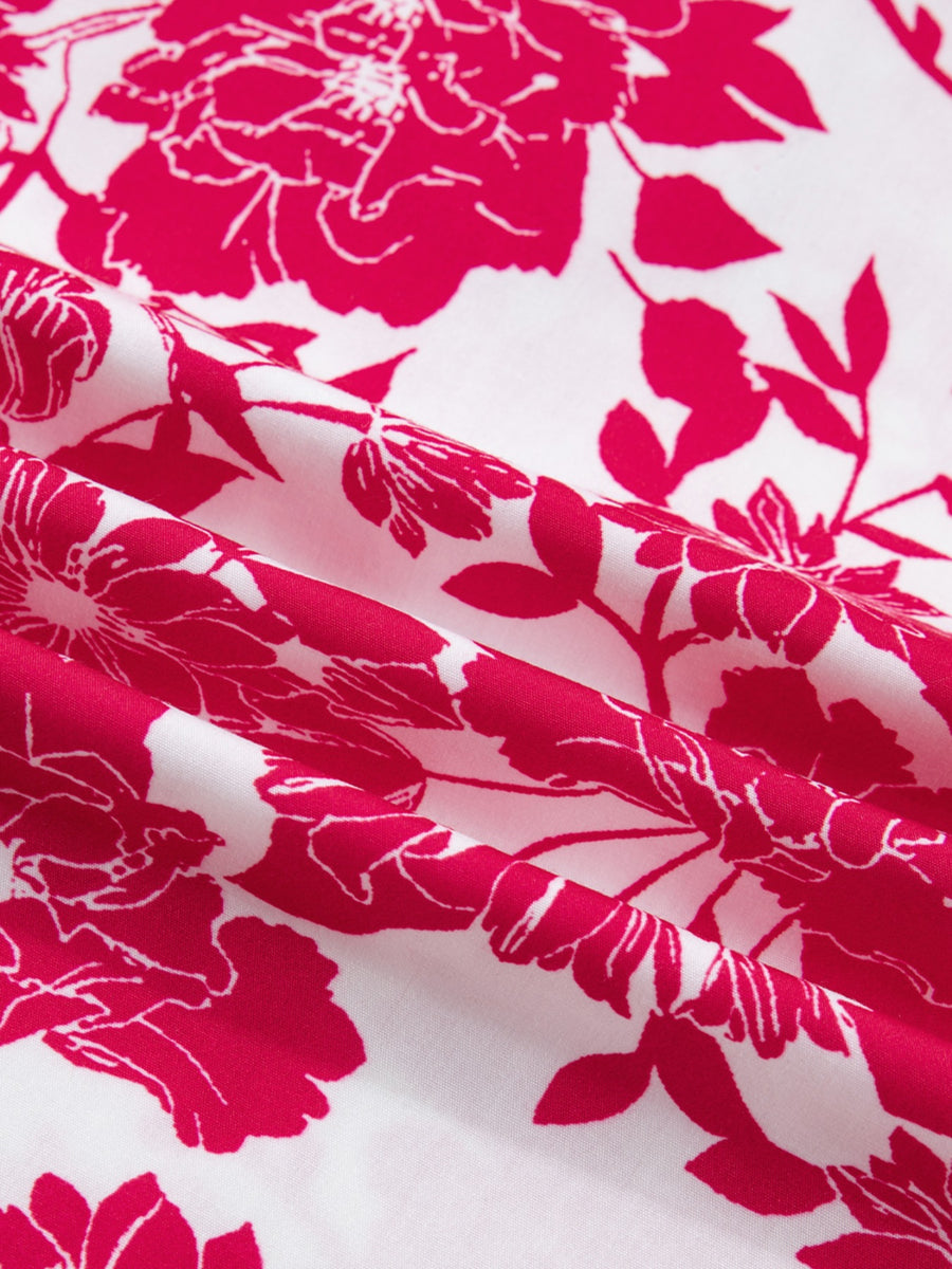 Floral print polyester blouse with lace detail and bright pink flowers on white.