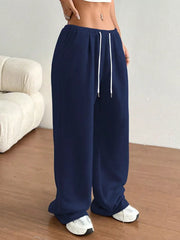 Dark blue wide-leg lounge pants with drawstring waist and pockets.