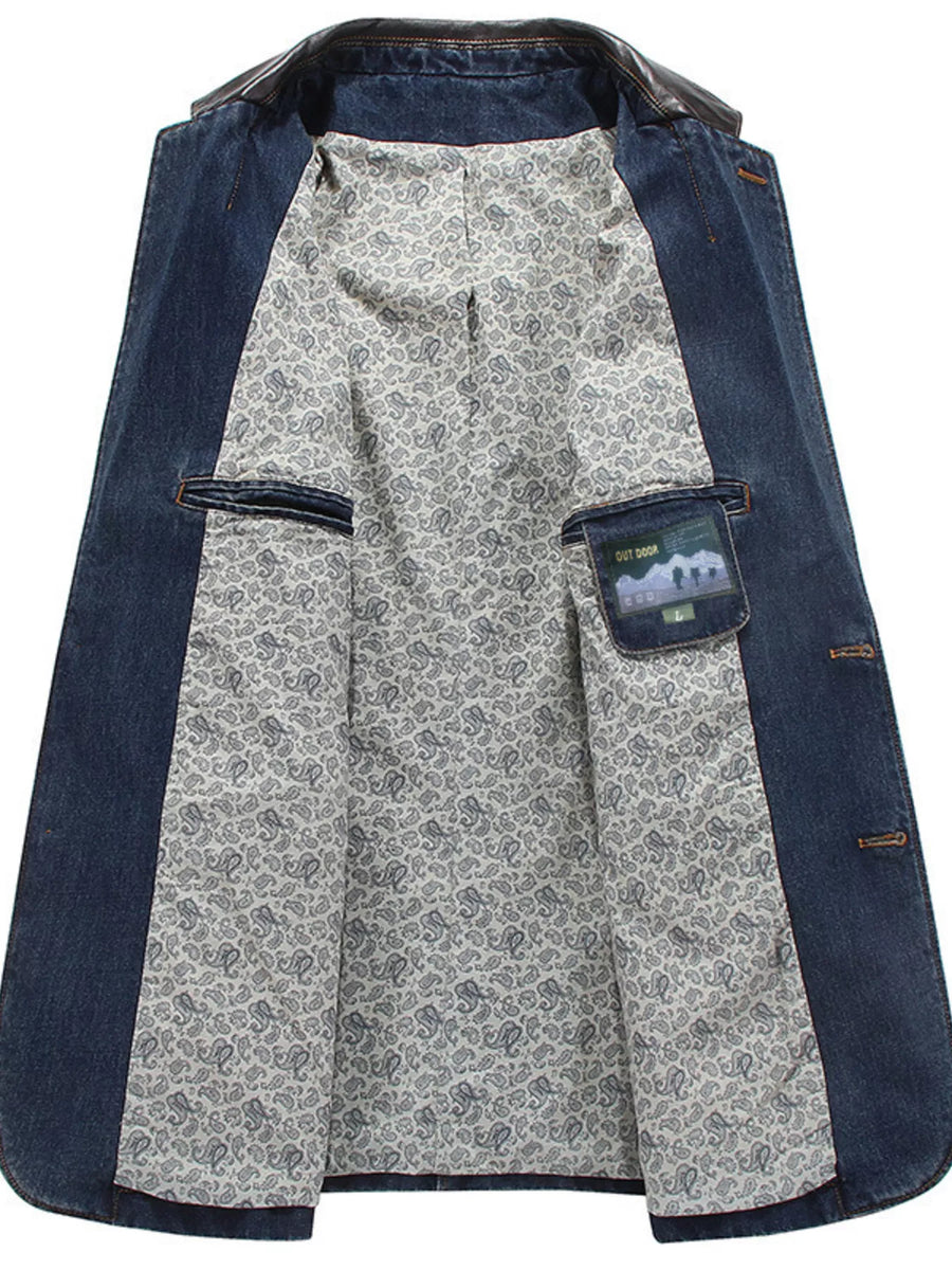 Denim blue blazer with paisley lining and leather collar. Features button-up front and interior pockets.