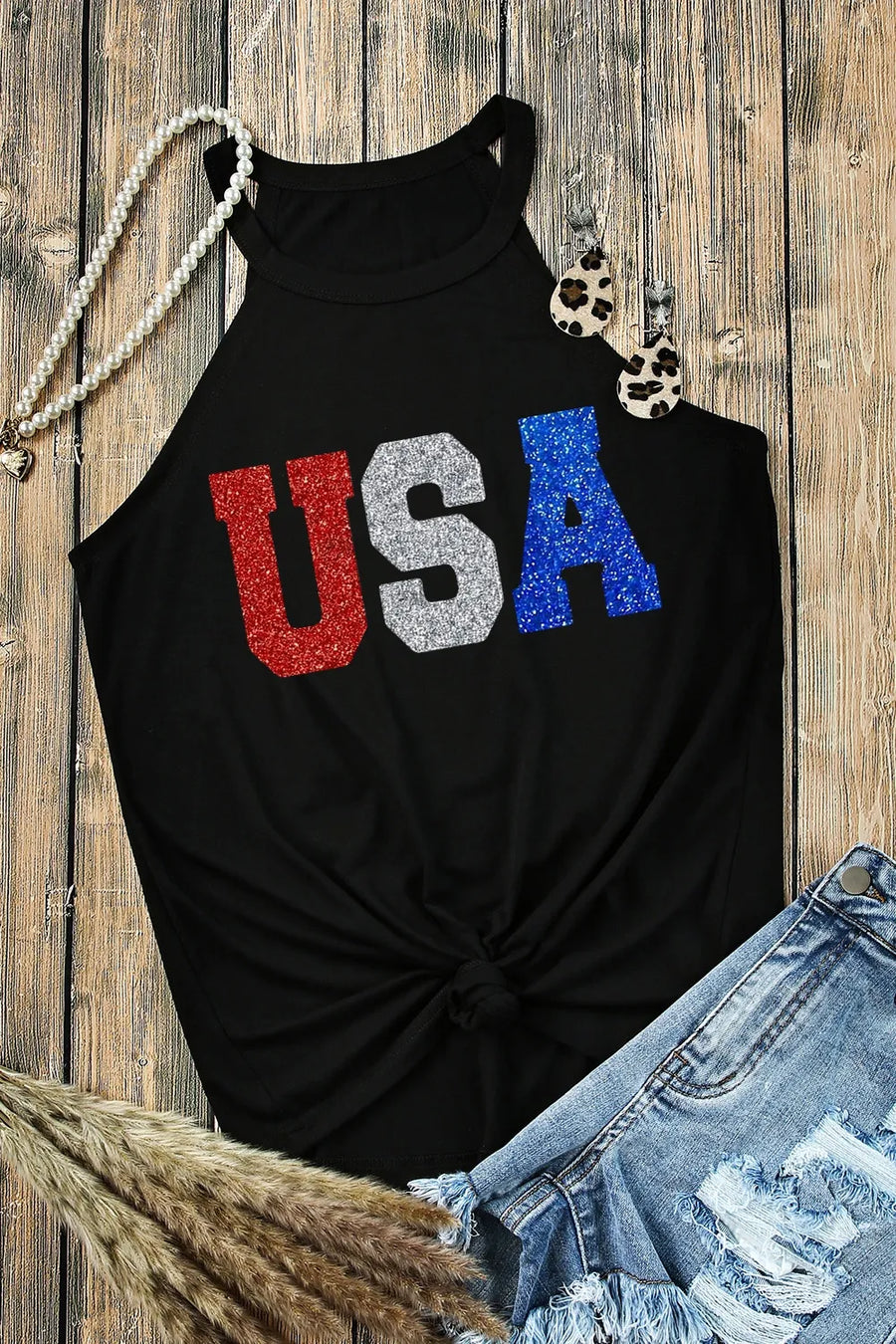 Black halter tank top with glitter USA graphic and knotted hem
