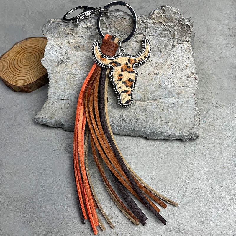 Cowhide bull skull keychain with leopard print and multi-color fringe tassels.