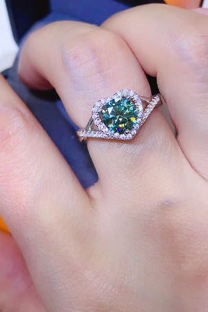 Green heart halo moissanite engagement ring in silver with pave band.