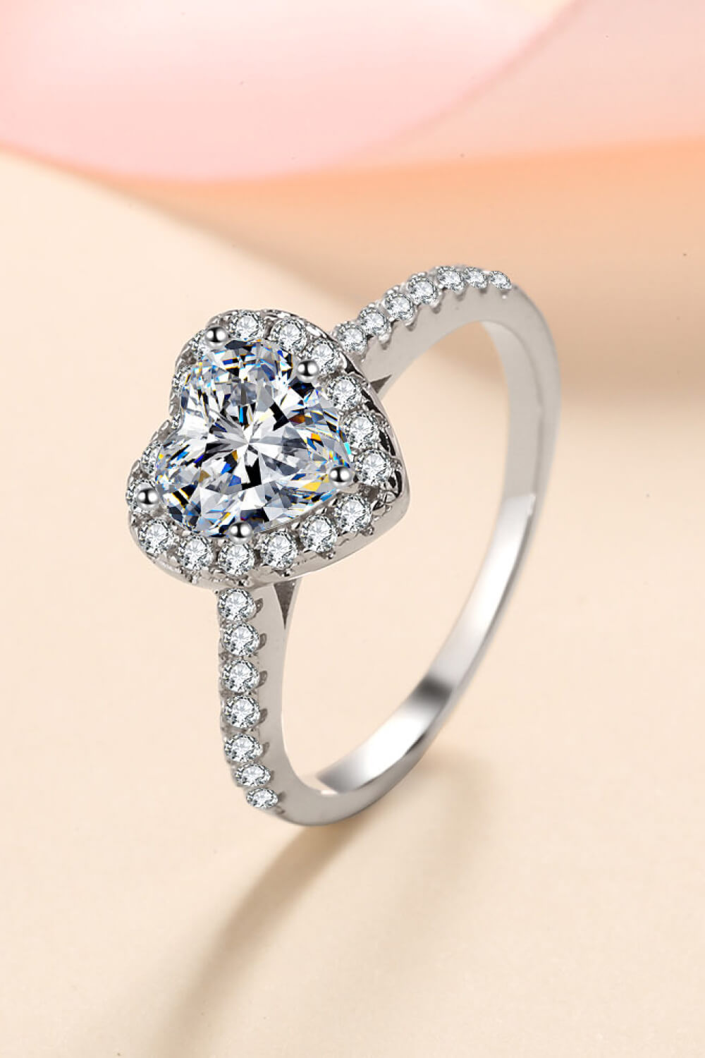 Silver heart-cut halo diamond ring with pavé band